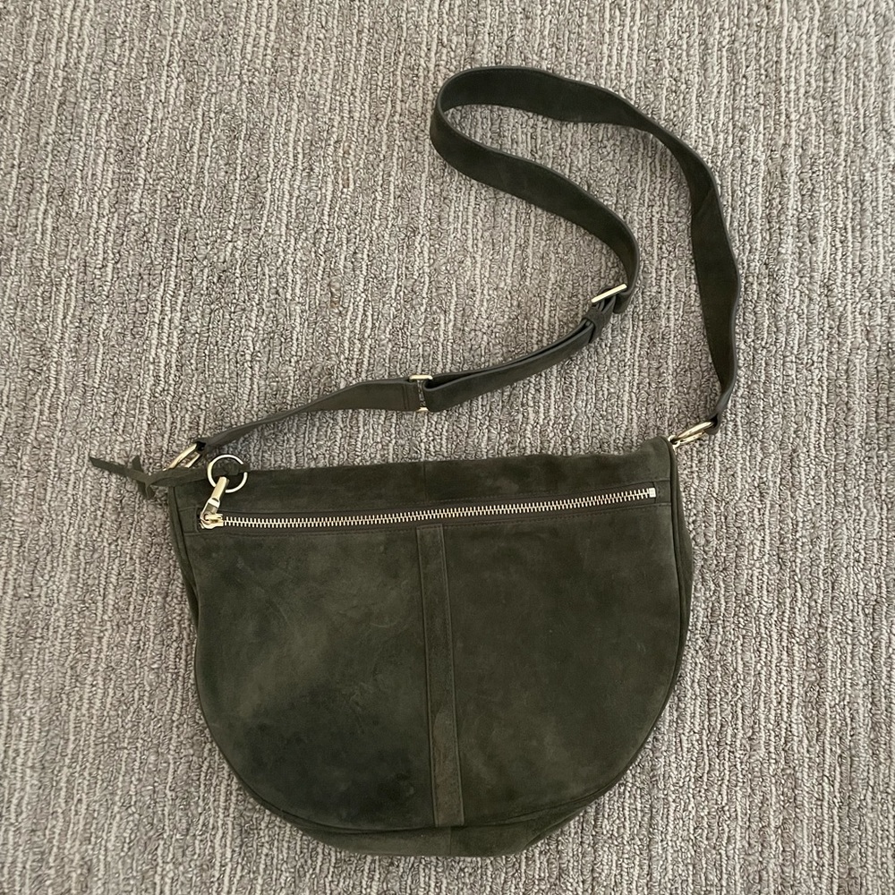 A dark green ELIZABETH and JAMES purse